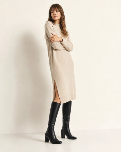 Women's black knee-high boots with a broad block heel, full silhouette.