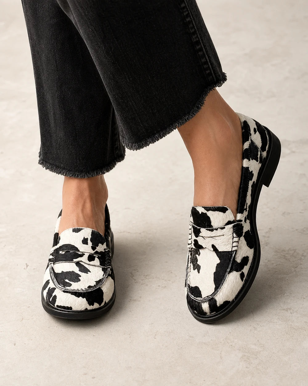 Rosalind | Cow Print Comfort Penny Loafers — loafers-for-women-patterned-slip-on-1-black-white-01-worn-hero.webp