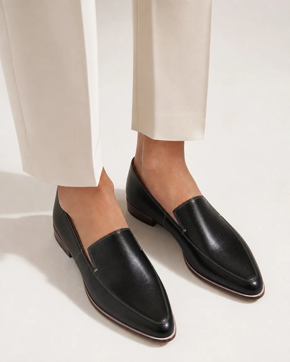 Cordelia | Black Leather Pointed Toe Professional Loafers — loafers-for-women-pointed-toe-slip-on-flats-black-01-worn-hero.webp