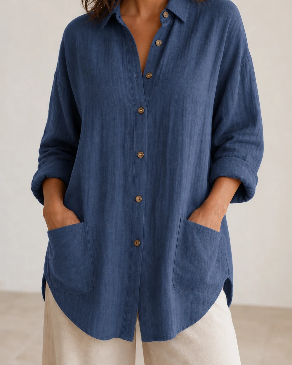 Women's dark blue relaxed longline shirt, front product view.