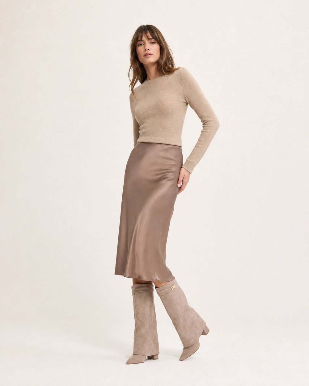 Women's beige wide-shaft suede-effect knee-high boots with midi-skirt styling.